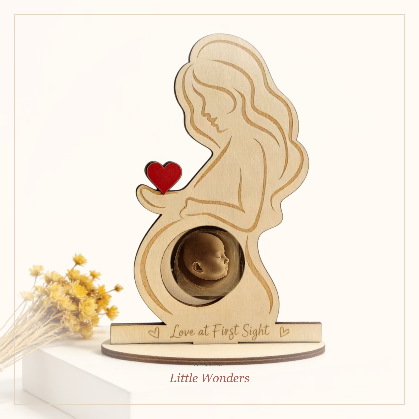 Wooden ultrasound keepsake frame with baby sonogram in the belly cutout